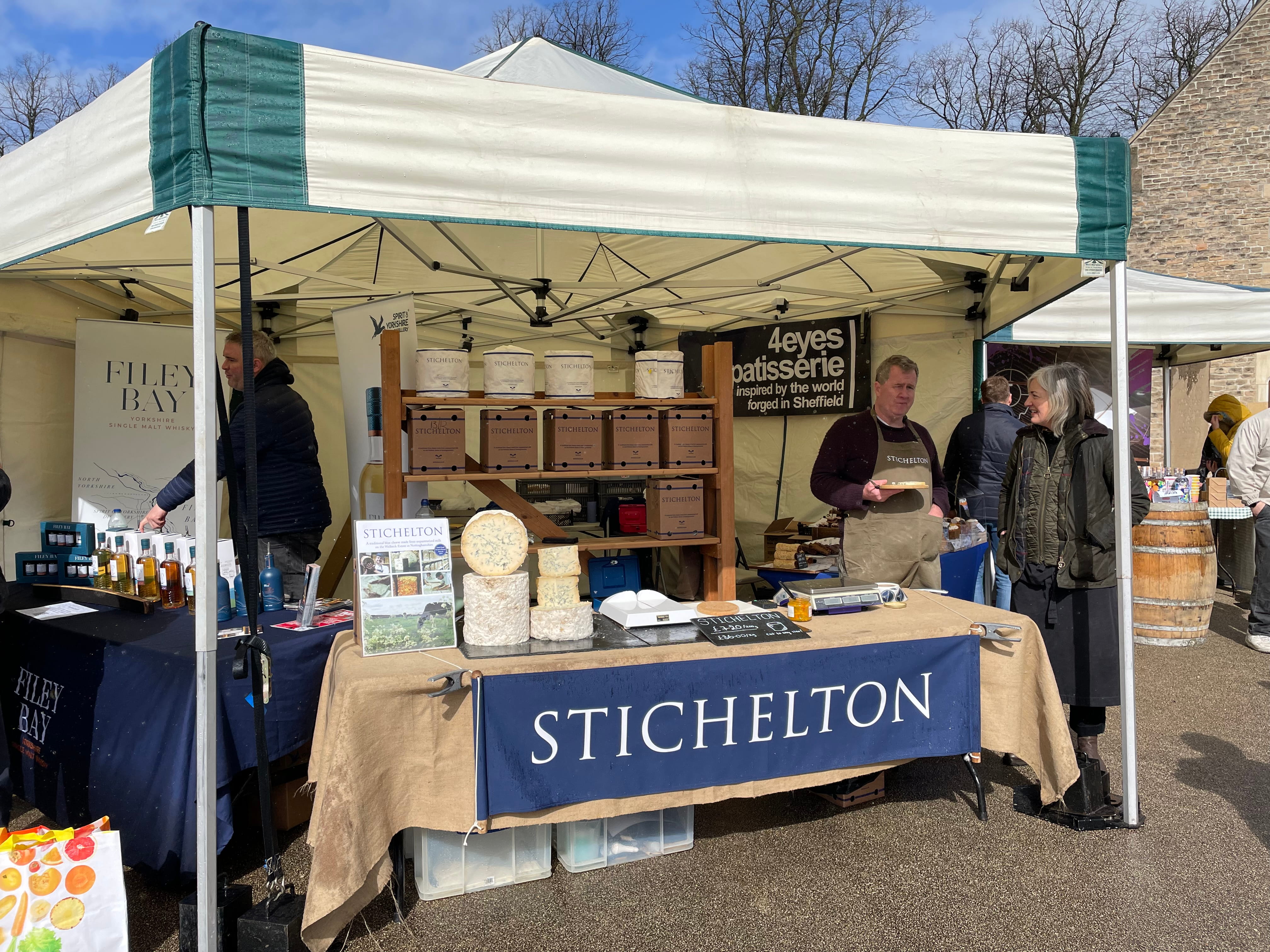 A 3m x 3m mini marquee gazebo used as an artisan vendor stall at the Welbeck Easter Market, showcasing local produce including Stichelton cheese